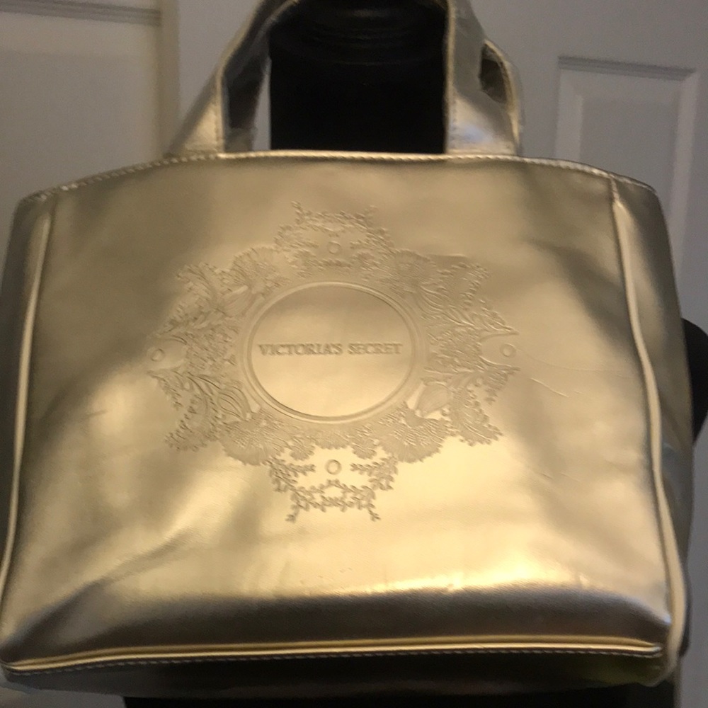 Victoria’s Secret Gold with White Trim Hand Bag, includes a makeup clutch.  NWOT